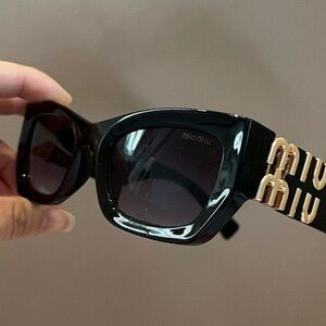 Miu Miu Black and Gold Sunglasses